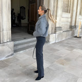 Women's trendy grey wool cropped trucker jacket with long sleeves, a classic collar, and structured blazer-like design, suitable for winter outerwear.