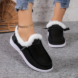 Women's turquoise fur-lined slip-on shoes displayed against a white background, showcasing stylish winter footwear design with black and blue elements.