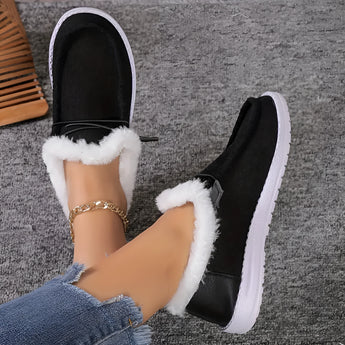 Women's turquoise fur-lined slip-on shoes featuring a stylish design, tailored for winter comfort.