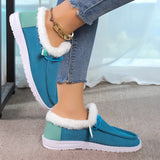 Women's turquoise slip-on shoes with fur lining, featuring a stylish winter design in shades of blue and black.