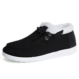 Women's turquoise fur-lined slip-on shoes in black, designed for winter, featuring a sporty and stylish look suitable for outdoor activities.