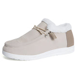 Women's beige slip-on shoes in EU size 43 with turquoise fur lining, designed for stylish winter wear and outdoor walking.