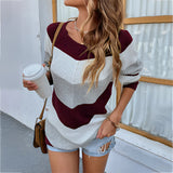 Women's oversized knit sweater in mustard yellow with a v-neck and striped pattern, shown in an XL size.