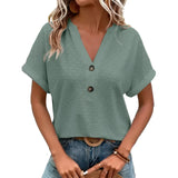 Women's green V-neck textured blouse with short sleeves and geometric pattern, size 3XL, paired with jeans.