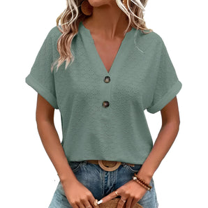 Women's green V-neck textured blouse with short sleeves and geometric pattern, size 3XL, paired with jeans.