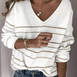 Women's V-neck white striped sweater in size 2XL, featuring chic fall fashion knitwear with a stylish design, modeled with a focus on shoulders and arms, showcasing the versatility of the outerwear.