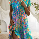 Women's short sleeve summer dress with a vibrant floral print, featuring a fitted waist and an azure color palette.