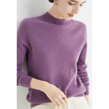 Women's vibrant red cashmere turtleneck sweater in size 2XL displayed on a mannequin, highlighting the premium knitwear fabric and detailed craftsmanship on the shoulders and sleeves.