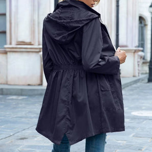 Women's lightweight purple raincoat featuring a hood, adjustable waist, and long sleeves, designed for fashion and practicality.