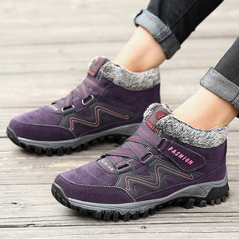 Women's waterproof insulated hiking boots in a stylish design featuring a color combination of white, purple, black, grey, and pink. The boots are designed for anti-slip walking and are suitable for outdoor sportswear activities.