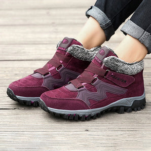 Women's waterproof insulated hiking boots in purple and grey with a stylish design and anti-slip sole.