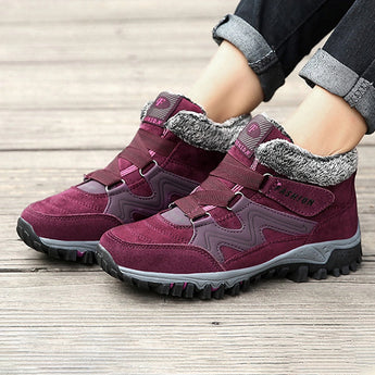 Women's waterproof insulated hiking boots in purple and grey with a stylish design and anti-slip sole.