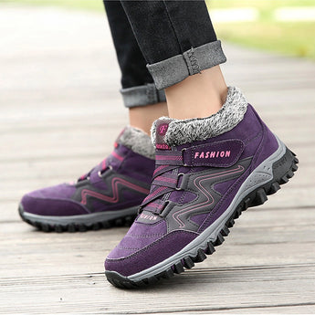 Women's waterproof insulated hiking boots in a stylish design featuring a mix of purple, black, grey, and violet colors with an anti-slip sole suitable for outdoor activities.