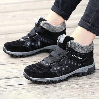 Women's waterproof insulated hiking boots in black and grey, featuring a stylish design with anti-slip soles, perfect for outdoor activities and walking.
