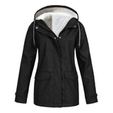 Women's black waterproof insulated parka with a fur-lined hood, featuring long sleeves and a high collar.
