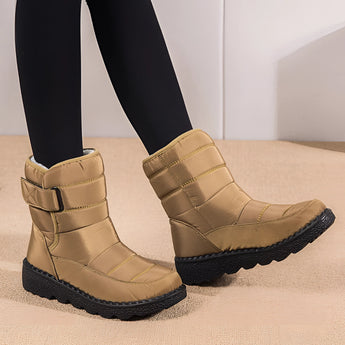 Women's waterproof insulated snow boots in beige with a durable non-slip wedge sole, suitable for cold weather and thermal protection.