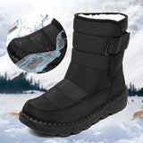 Women's waterproof insulated snow boots with a non-slip sole, designed for outdoor use in snowy conditions. The boots are made from durable materials, featuring a thermal lining to keep feet warm.