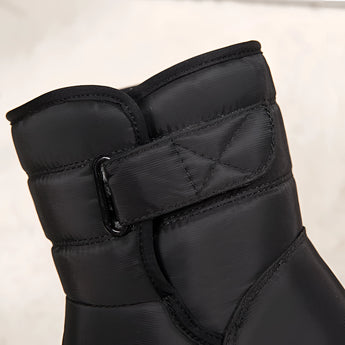 Women's waterproof insulated snow boots in grey, designed for outdoor use with a durable and non-slip sole, featuring thermal lining for warmth.