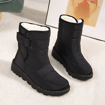 Women's waterproof insulated snow boots designed for durability and non-slip performance, featuring a thermal interior, synthetic rubber sole, and a stylish pattern in carmine color.