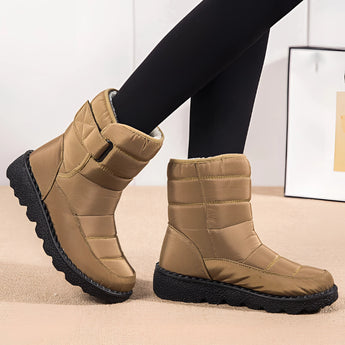 Women's brown waterproof insulated snow boots designed for durability, featuring a non-slip sole and thermal insulation, suitable for outdoor use.