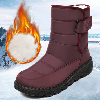 Red women's waterproof insulated snow boots in size 44, featuring a durable and non-slip design, made from synthetic rubber material suitable for outdoor use in snowy conditions.