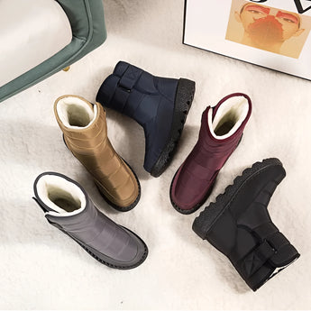 Women's brown waterproof insulated snow boots made of durable leather, designed with a non-slip sole and thermal protection, suitable for cold weather and outdoor activities.