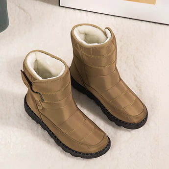 Women's waterproof insulated snow boots in beige featuring a durable design with non-slip synthetic rubber soles and thermal insulation for warmth.