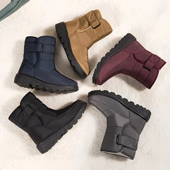 Women's waterproof insulated snow boots in grey with a durable, non-slip sole and thermal lining for added warmth.