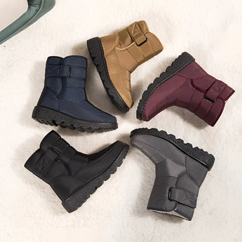 Women's waterproof insulated snow boots in grey, designed for warmth and durability, ideal for winter conditions and featuring a non-slip sole.