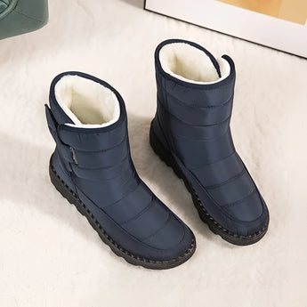 Women's waterproof insulated snow boots in electric blue, featuring a non-slip sole, thermal lining, and durable design with synthetic rubber and leather materials.