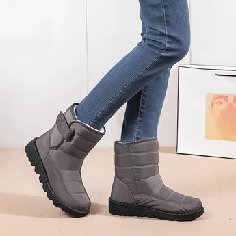
A pair of women's waterproof insulated snow boots designed for durability and non-slip traction, perfect for keeping feet warm and dry in winter conditions.