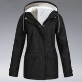 Women's yellow hooded winter parka with waterproof and insulated material, featuring full sleeves and a collar.