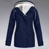 Women's dark blue insulated hooded winter parka with waterproof material, featuring a button-up front, long sleeves, and a cozy collar for added warmth.
