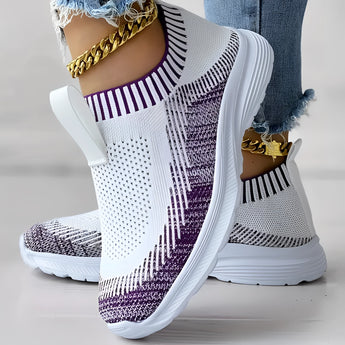 Women's purple knit slip-on sneakers with a breathable and lightweight design, featuring a white and black color scheme.