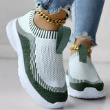 Women's white and black knit slip-on sneakers designed for breathability and lightweight comfort, suitable for walking and outdoor activities.