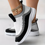 Women's black knit slip-on sneakers with a white sole, shown in size 40.5.