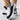 Women's black knit slip-on sneakers with a white sole, shown in size 40.5.