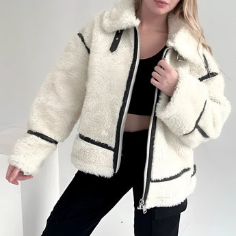 
A stylish and cozy women's white faux fur winter jacket featuring a high collar, long sleeves, and a tailored waist, perfect for street wear.