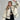 
A woman wearing a stylish and cozy white faux fur winter jacket. The jacket features long sleeves and a high collar, providing warmth and comfort. The woman is posing with her hands near her waist, showcasing the outerwear's chic design. The image highlights the jacket's fashionable appeal and winter-ready functionality, suitable for street wear.