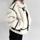 Women's white faux fur winter jacket with long sleeves and a cozy collar, showcasing stylish street wear design.