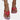A pair of Women's White Flat Sandals featuring a rhinestone ankle chain, shown on a foot with red nail polish against a red background, highlighting summer fashion style.