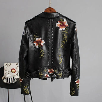 Women's white leather bomber jacket featuring intricate floral embroidery, showcasing a stylish spring moto design with a classic collar, full sleeves, and fitted waist.