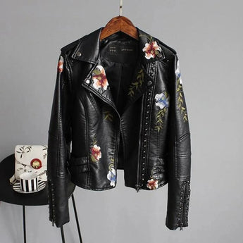 Women's black leather bomber jacket with white floral embroidery, featuring long sleeves and a classic collar design, in size XL.
