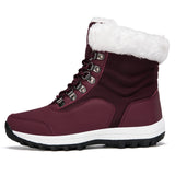 Women's white fur-lined insulated snow boots designed for winter wear, featuring a non-slip sole for enhanced traction and safety in icy conditions.