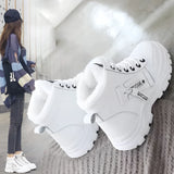 Women's white fur-lined lace-up ankle winter boots displayed on a neutral background, featuring a cozy fur lining, sturdy lace-up design, and ankle-high coverage, ideal for cold winter weather.