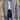 Women's gray lightweight quilted insulated winter jacket in size 2XL, featuring a fashion-forward design with a white and gray color scheme, long sleeves, and a comfortable fit.