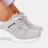 Women's white platform sneakers with zipper, designed for style and comfort as walking shoes, featuring a sleek and modern fashion design suitable for both casual and athletic wear.