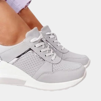 Women's white platform sneakers with zipper, designed for style and comfort as walking shoes, featuring a sleek and modern fashion design suitable for both casual and athletic wear.