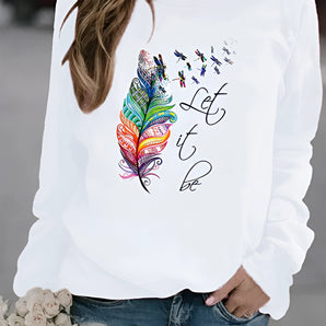 Women's white sweatshirt featuring a "Let It Be" feather print in a bohemian style, shown paired with blue jeans. The sweatshirt has long sleeves and a comfortable, casual fit, perfect for a fashionable and relaxed look.
