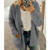 Dark gray women's teddy coat in a soft plush fabric, worn by a person who is also wearing sunglasses and a dress shirt. The coat is fluffy and suitable for winter, with an emphasis on its cozy and warm texture. The model is showcasing the 5XL size.
